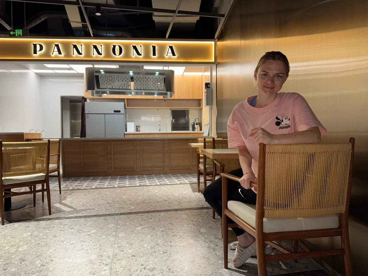 Bianka seated in the PANNONIA café in Shanghai