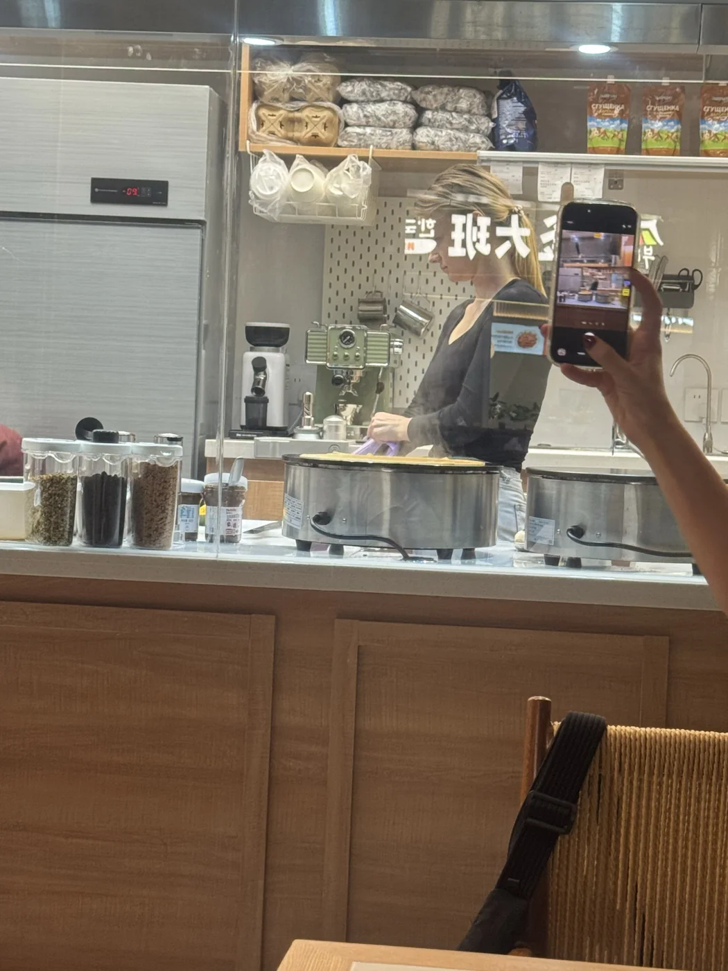 PANNONIA’s open kitchen, seen through the café window